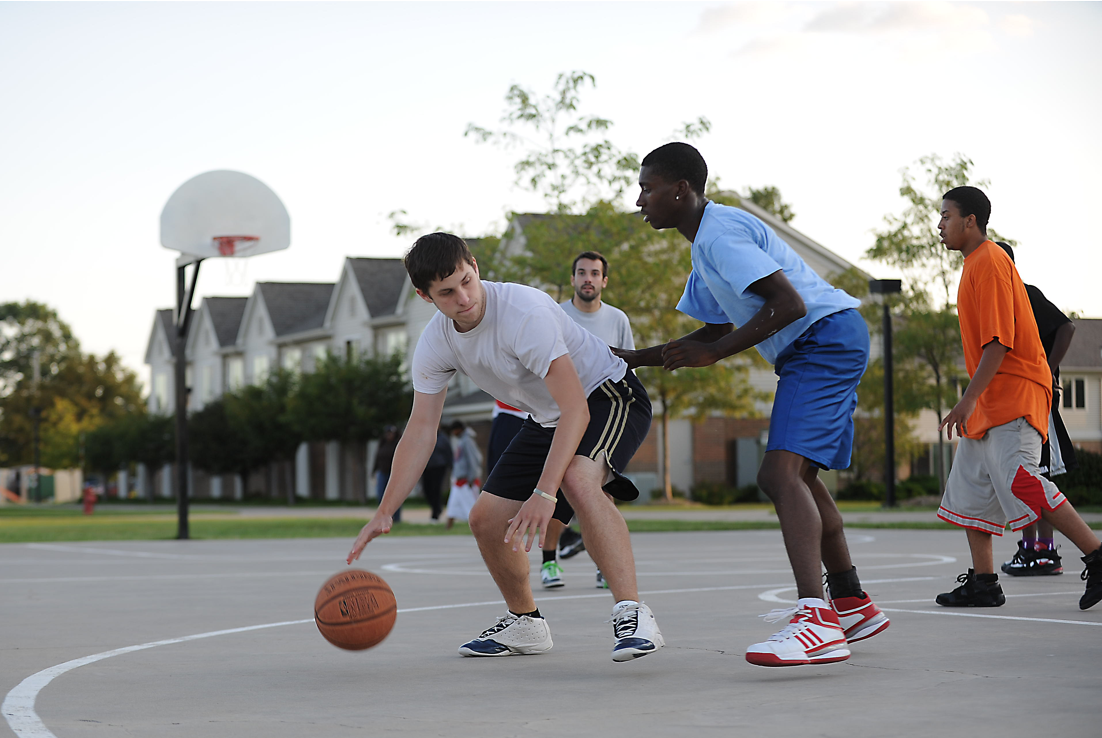 Freshmen students playing basketball.