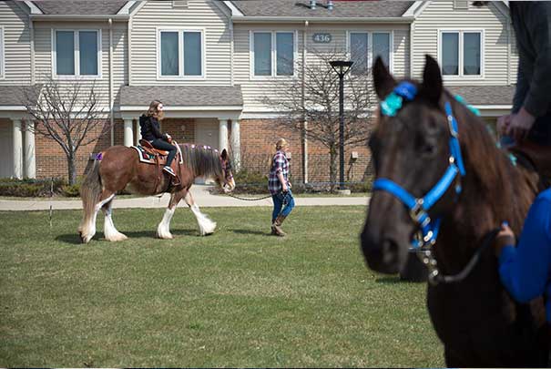 students riding horses at animal petting zoo at the UVs