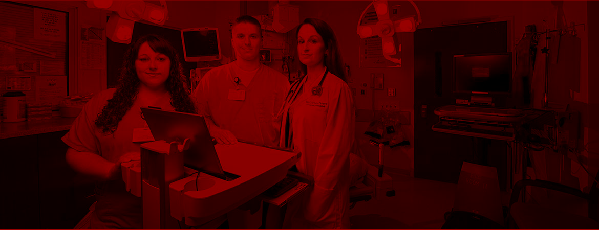 Medical scribes in Covenant Emergency room with red overlay. 