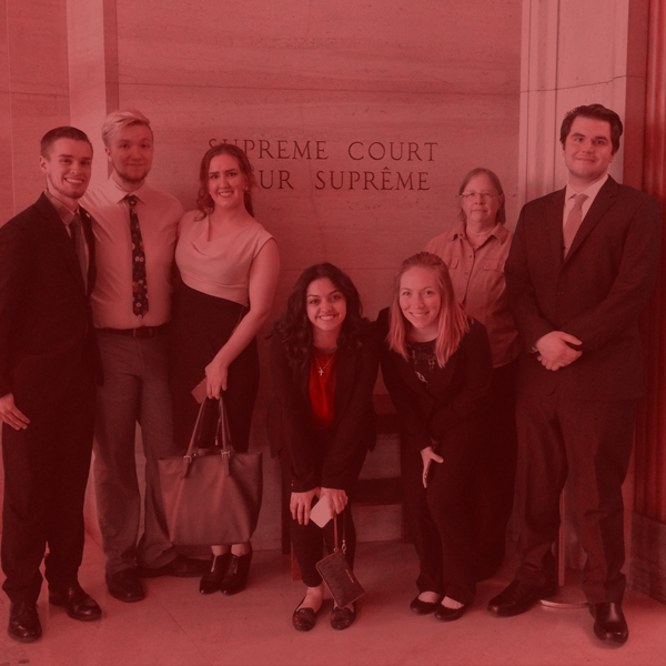 Group of Law Club students and advisor outside of the Supreme Court