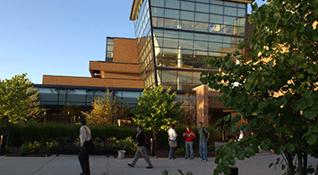 SVSU's Zahnow Library exterior as students walk by.