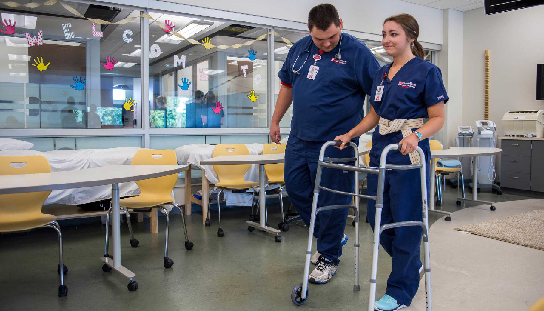 A nursing students using a walker