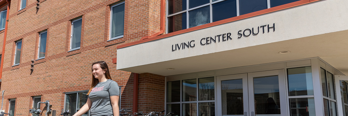 Living Center South with student walking