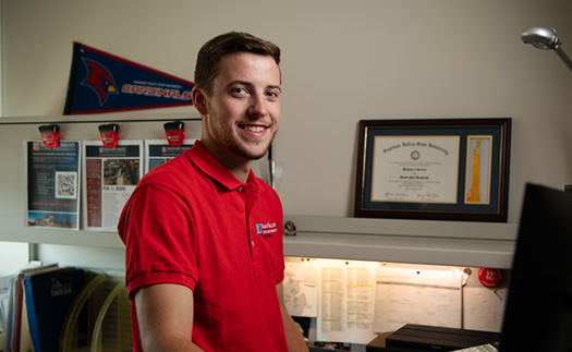 Mason at his desk in his office