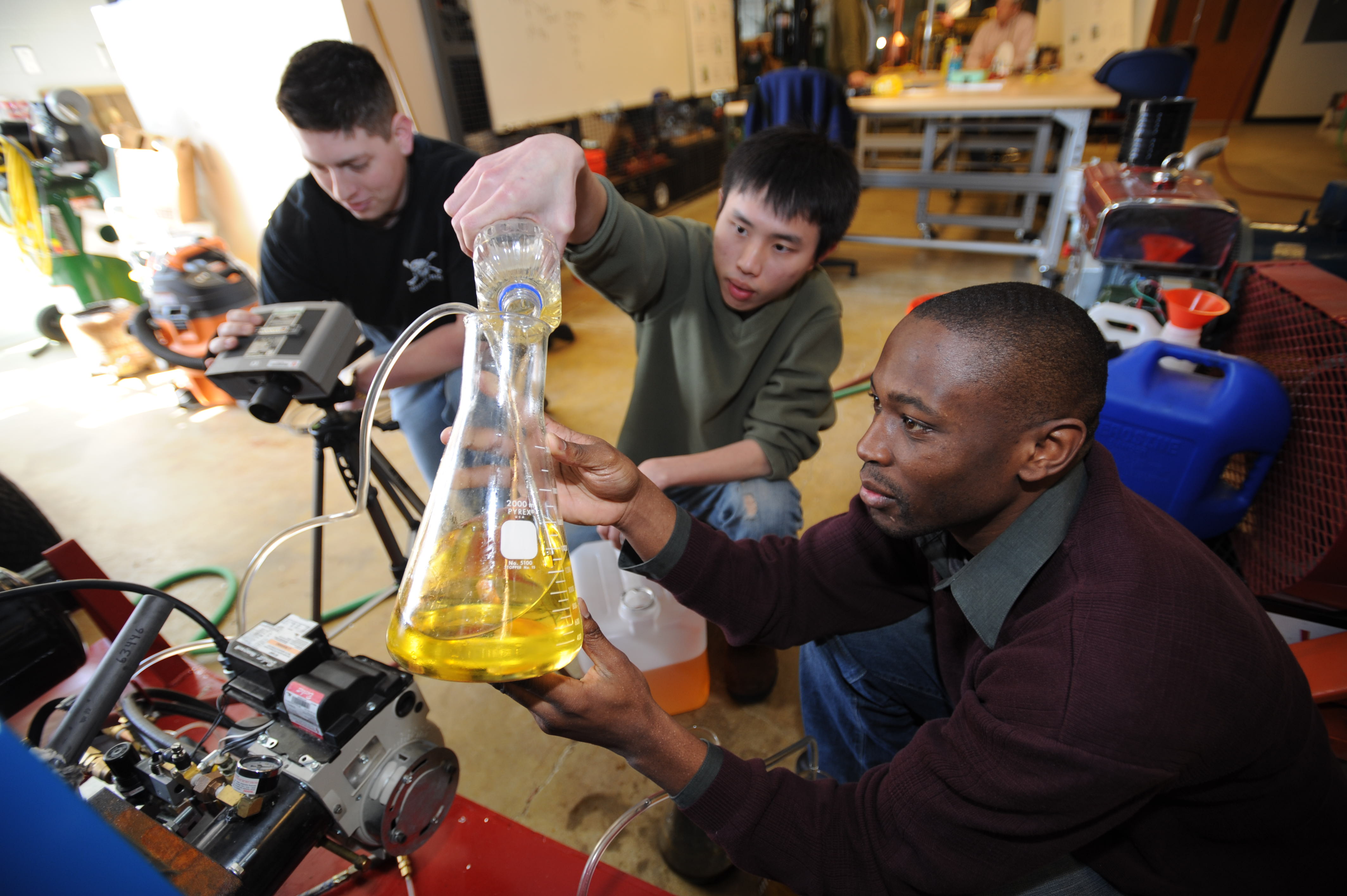 Image of students performing an experiment with fuel oil
