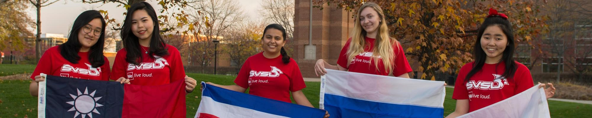 International students holding country flags