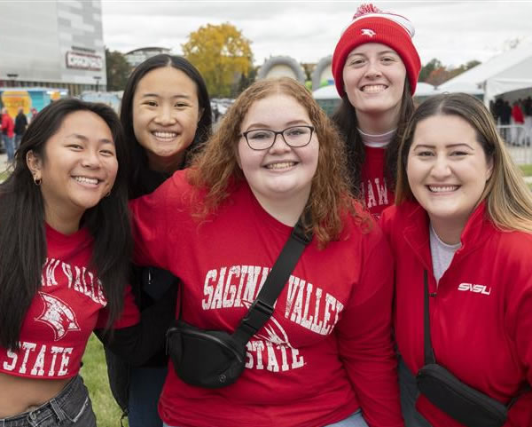 Five female students in outdoor commons